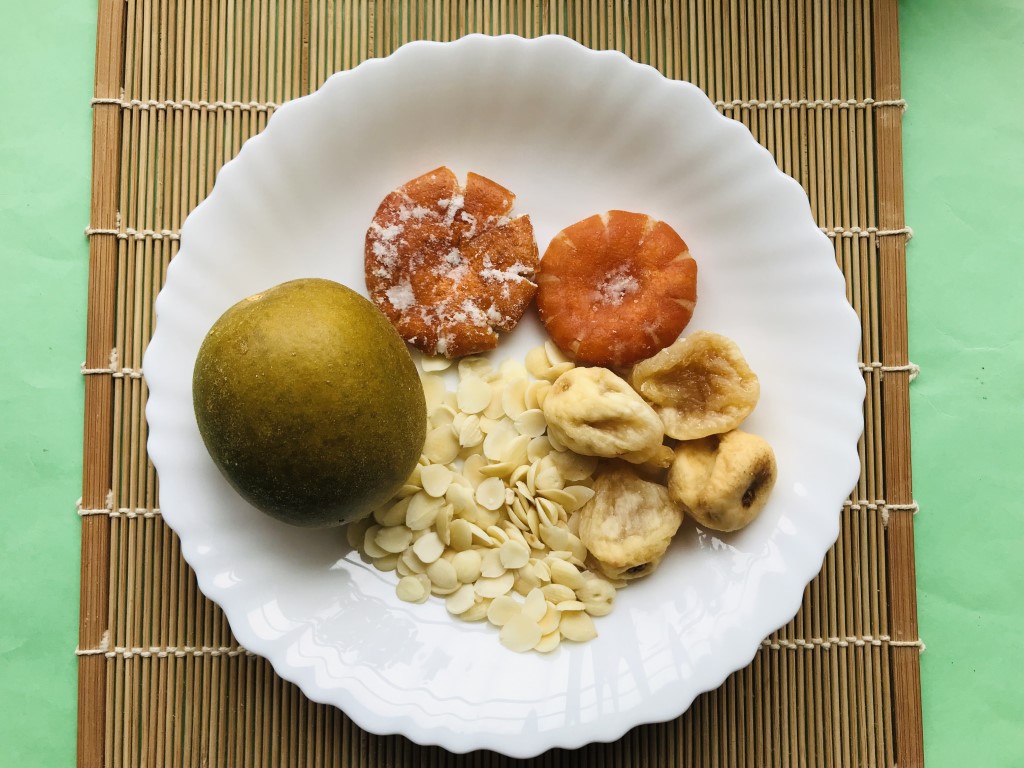 Golden Monk Fruit, Tangerine Cake, Apricot Kernel, and Fig Tea
